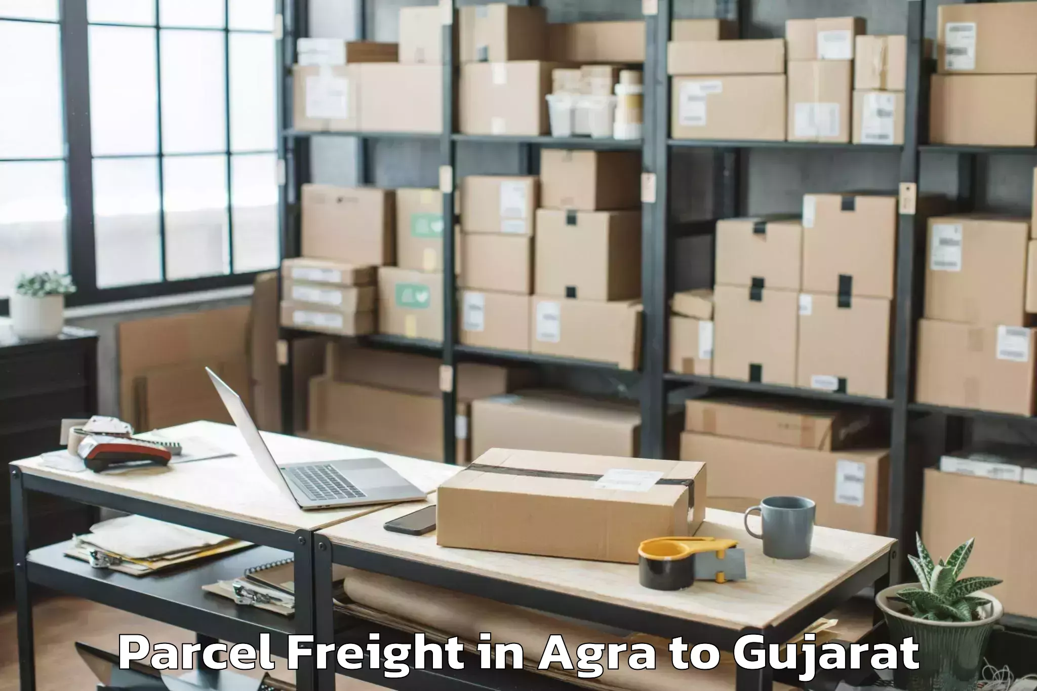 Reliable Agra to Rai University Ahmedabad Parcel Freight